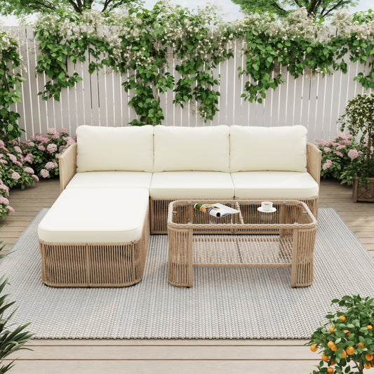 Alba outdoor sofa and two chairs arranged around the glass-top table