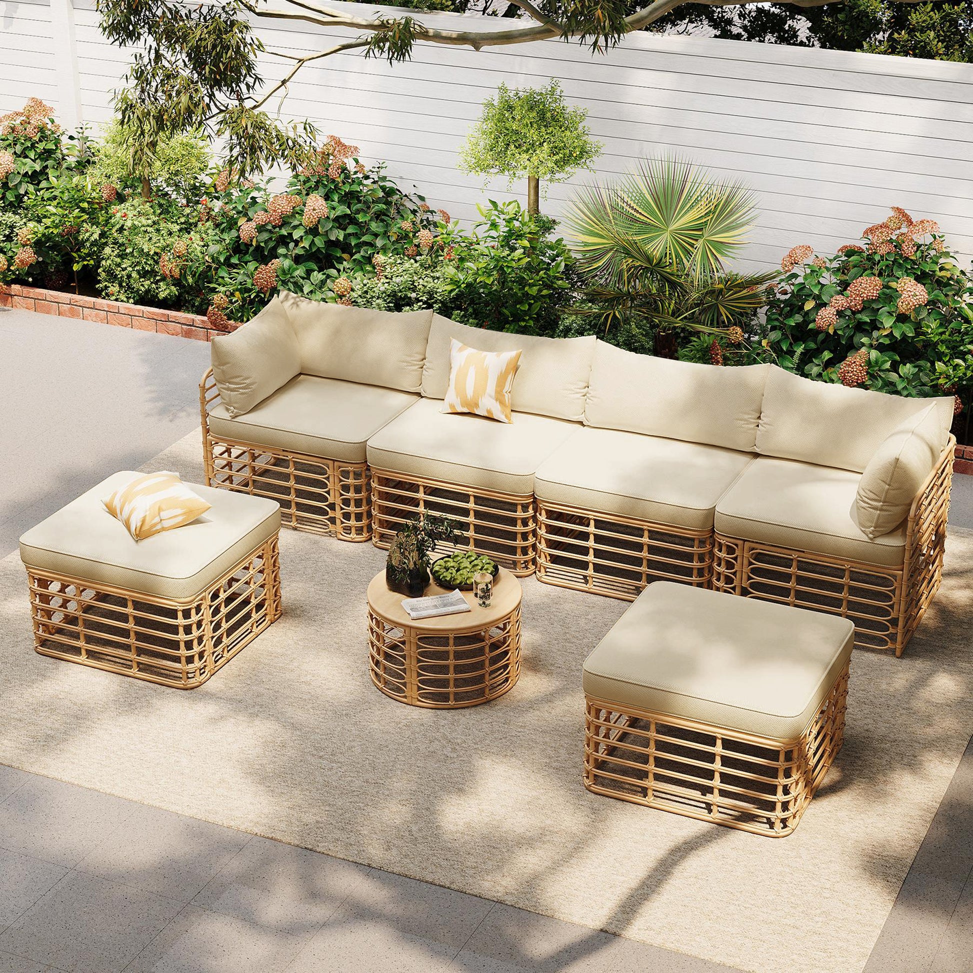 Ondine outdoor sectional arranged in a U-shape around the round table